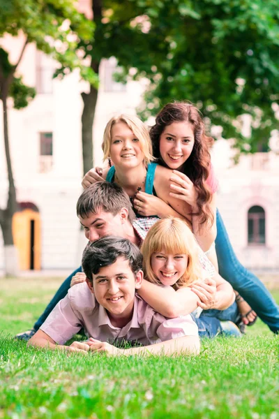 Group of happy smiling Teenage Students Outside — Stock Photo, Image