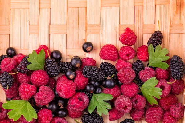 Fresh berries on a wicker backgound — Stock Photo, Image