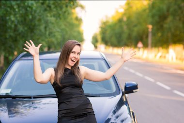 Happy and excited business woman in her car clipart
