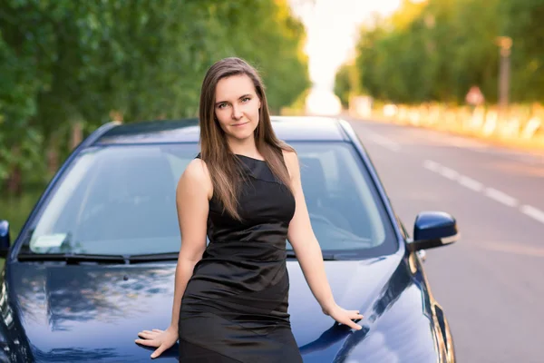 Beautiful businesswoman near her car — Stock Photo, Image