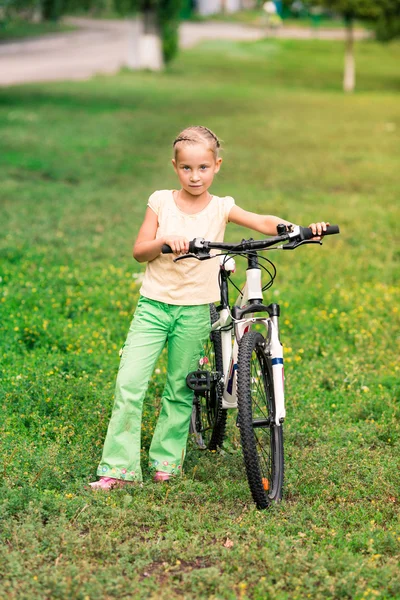 Little girl riding a bicycle — Stock Photo, Image