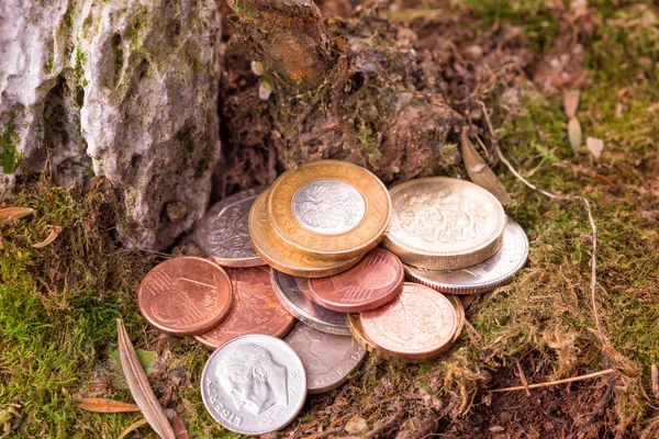 Different old coins stacked on the ground — Stock Photo, Image