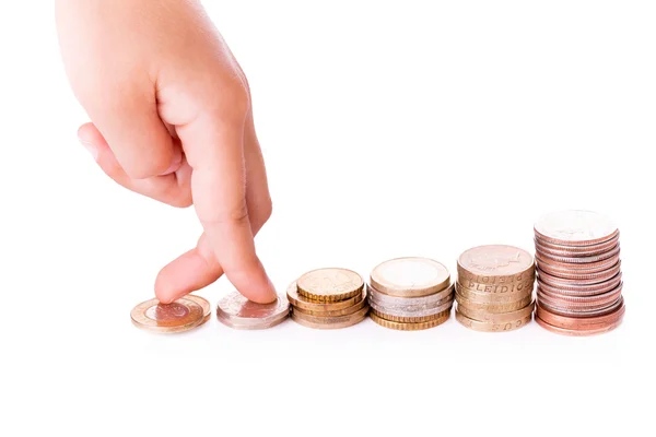 Fingers walking up on stacks of coins — Stock Photo, Image