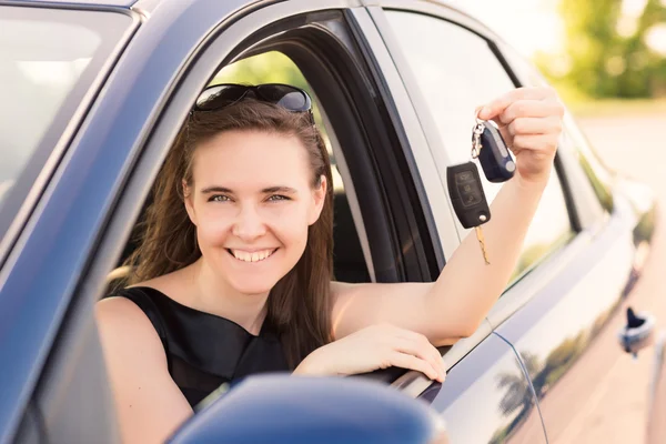 Beautiful businesswoman driving in the car — Stock Photo, Image