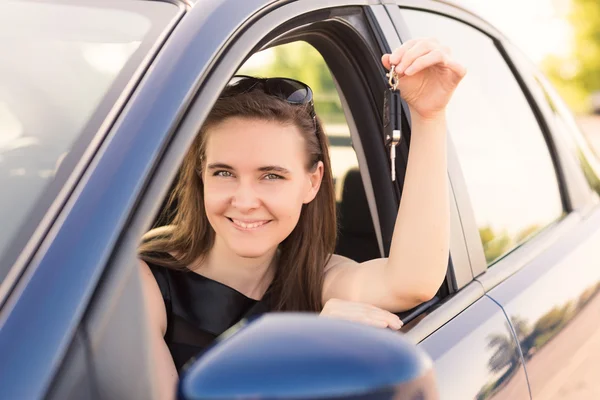 Beautiful businesswoman driving in the car — Stock Photo, Image