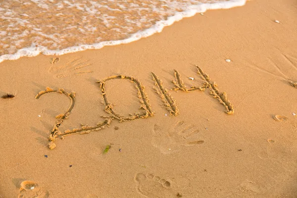 2014 numbers on the yellow sandy beach — Stock Photo, Image
