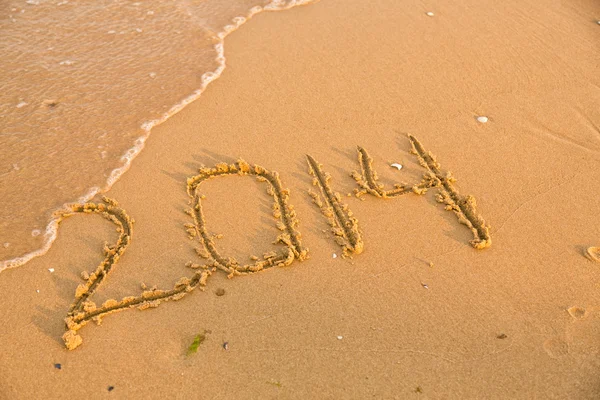 2014 numbers on the yellow sandy beach — Stock Photo, Image