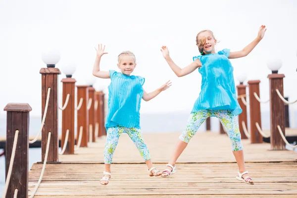 Portrait of beautiful little girls jumping — Stock Photo, Image