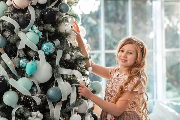 Cute Little Girl Decorating Christmas Tree Indoors Merry Christmas Happy — стокове фото
