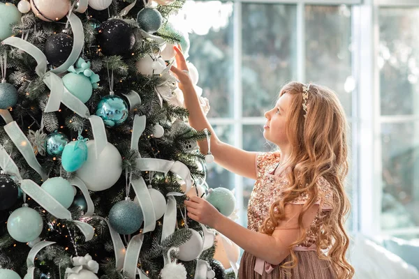 Cute Little Girl Decorating Christmas Tree Indoors Merry Christmas Happy — стокове фото