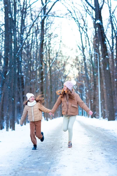 Two Teenage Girls Having Fun Playing Snow Snowy Winter Day — Fotografia de Stock
