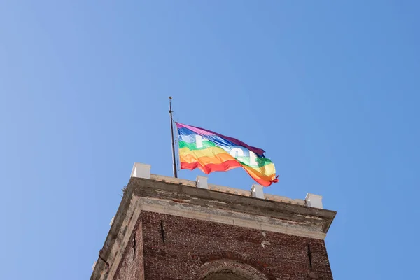 Rainbow flag with the word PACE Peace in Italian waving on the tower in Genoa, Italy. Support Ukraine concept — Photo