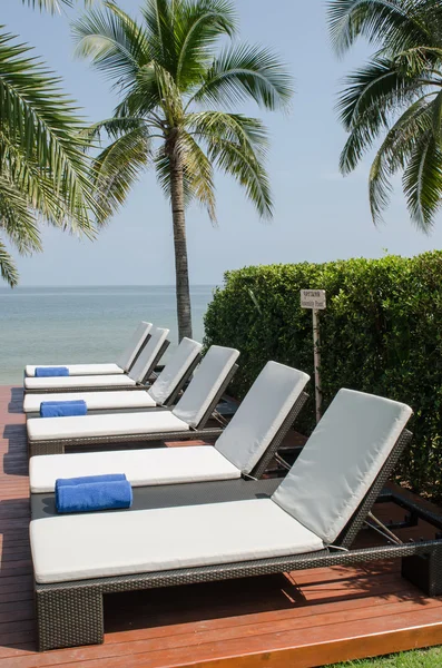 Empty sunbed with wrapped towels — Stock Photo, Image