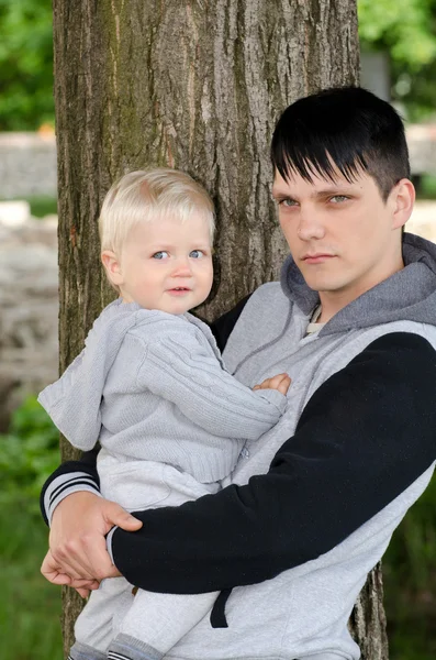 Young man and baby — Stock Photo, Image