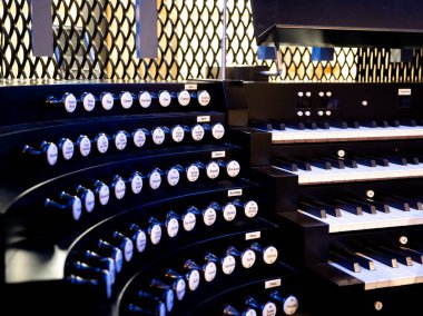 Organ musical instrument, keyboard and buttons, close up view 