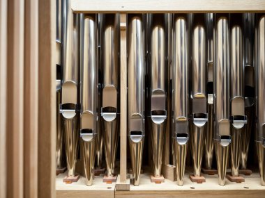 modern steel organ pipes, structure of organ, musical instrument. close up view inside of musical instrument