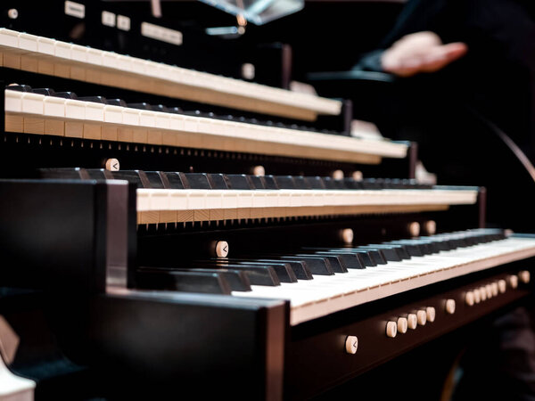 Organ musical instrument, keyboard and buttons, close up view 