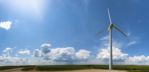 Stock Photo of windmill in blue sky with clouds — Stock Photo, Image