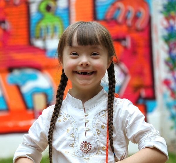 Portrait of beautiful young girl on the playground.