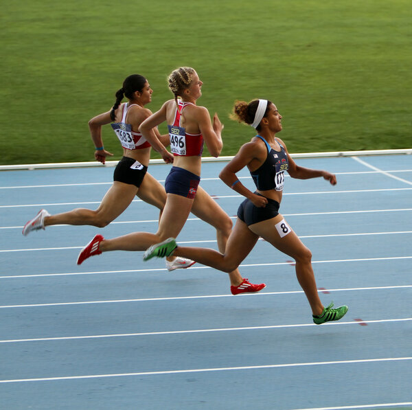 Athletes in the 400 meters race Stock Image