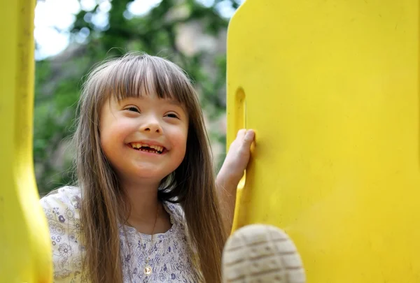 Portrait of beautiful young girl on the playground. — Stock Photo, Image
