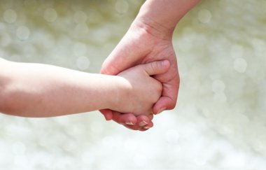 Hands of mother and child clipart
