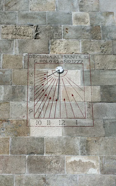 A wall sun clock on tower of Castle of Montjuic in Barcelona, Spain — Stock Photo, Image