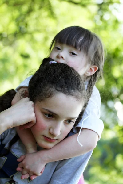 Portrait of beautiful young girls in the park — Stock Photo, Image