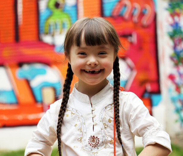 Portrait of beautiful young girl on the playground.