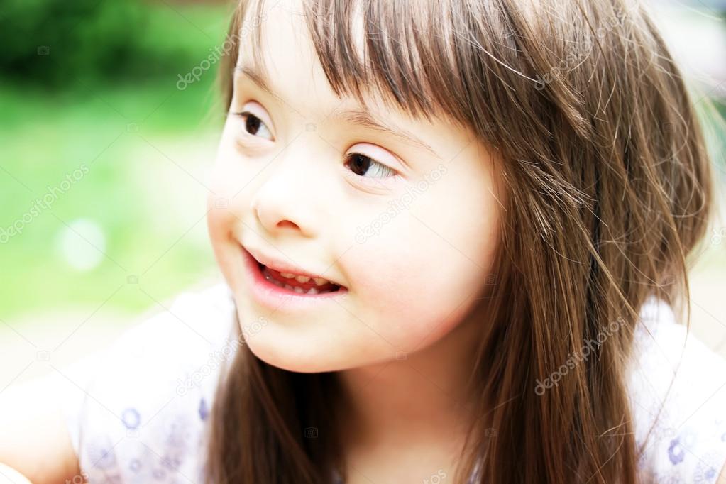 Portrait of beautiful young girl on the playground