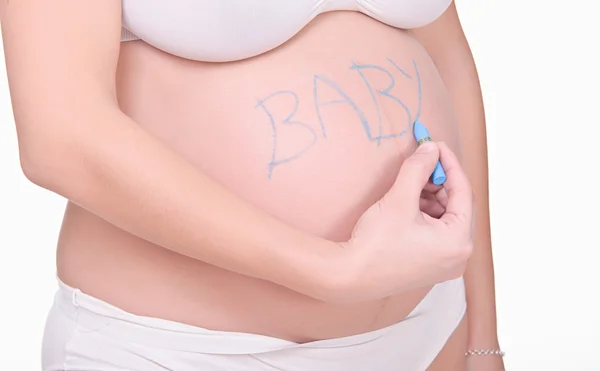 Bokstäver baby på gravid mage — Stockfoto