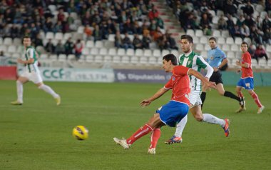 Cordoba, İspanya - Ocak 13:juanma marrero r(16) eylem sırasında maç lig cordoba(w) vs numancia (r)(1-0) üzerinde 13 Ocak 2013 baş melek cordoba İspanya Belediye Stadyumu