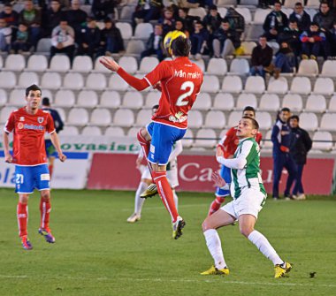 CORDOBA, SPAIN - JANUARY 13: Iván Malón R(2) in action during match league Cordoba(W) vs Numancia (R)(1-0) at the Municipal Stadium of the Archangel on January 13, 2013 in Cordoba Spain