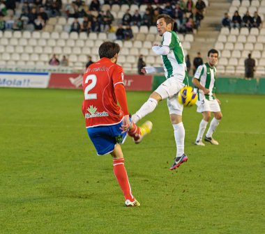 CORDOBA, SPAIN - JANUARY 13: Iván Malón R(2) in action during match league Cordoba(W) vs Numancia (R)(1-0) at the Municipal Stadium of the Archangel on January 13, 2013 in Cordoba Spain