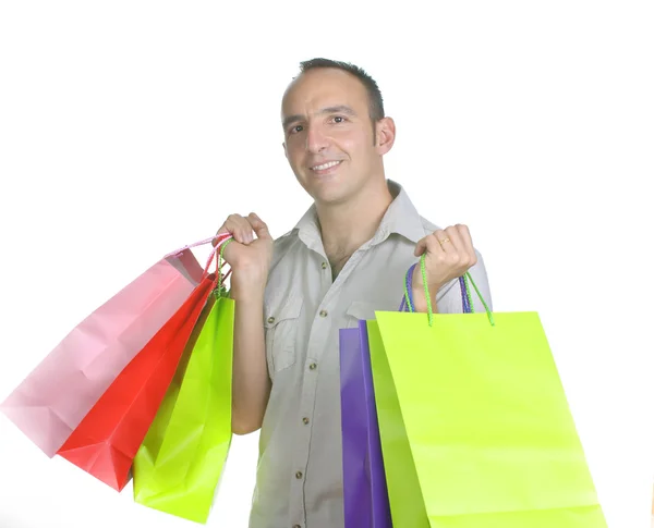 Hombre sonriente con varias bolsas de compras — Foto de Stock