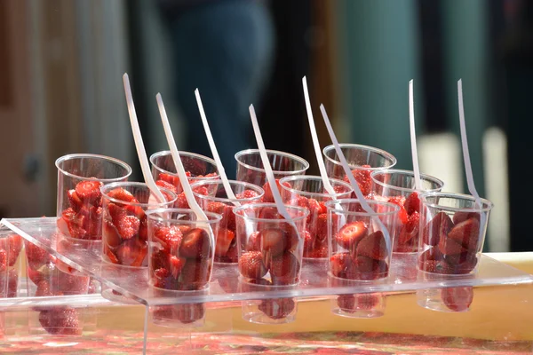 Strawberries in plastic cup — Stock Photo, Image