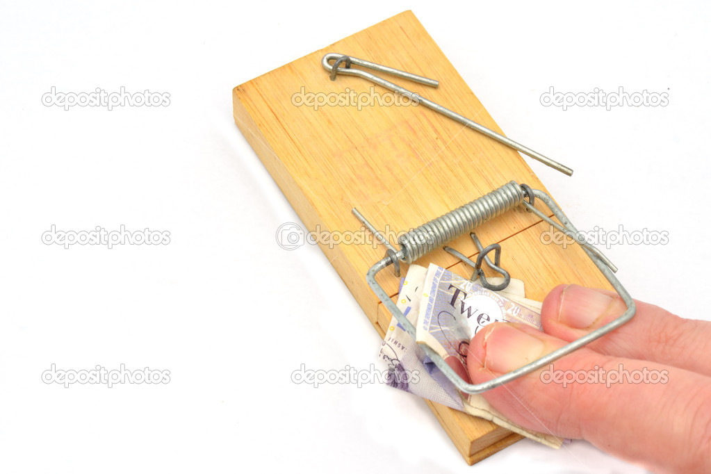 Fingers trapped in mousetrap grabbing money