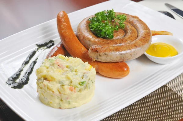 German sausage and salad — Stock Photo, Image