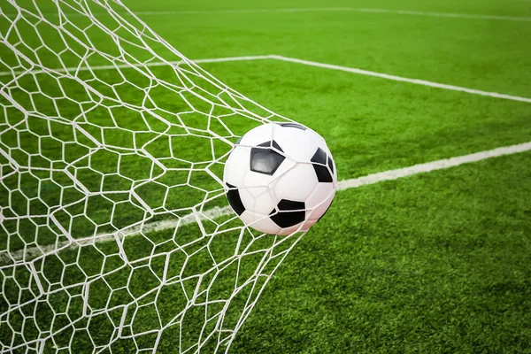 Football in the goal net — Stock Photo, Image