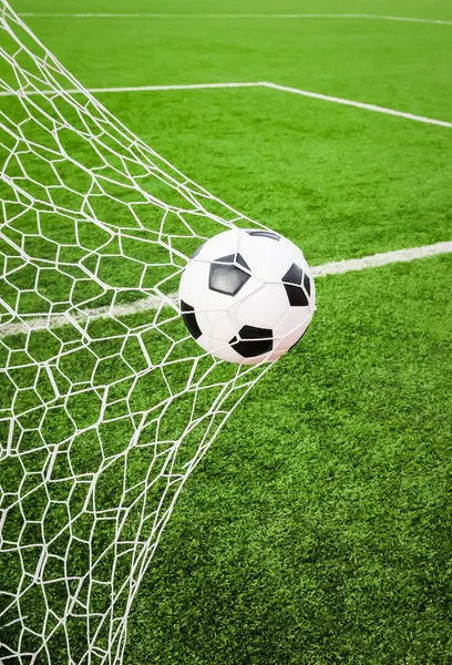 Soccer ball in goal net — Stock Photo, Image