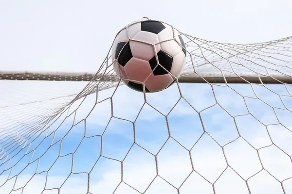 Soccer ball in goal net — Stock Photo, Image