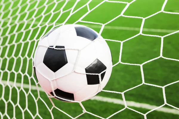 Soccer ball in the goal net — Stock Photo, Image