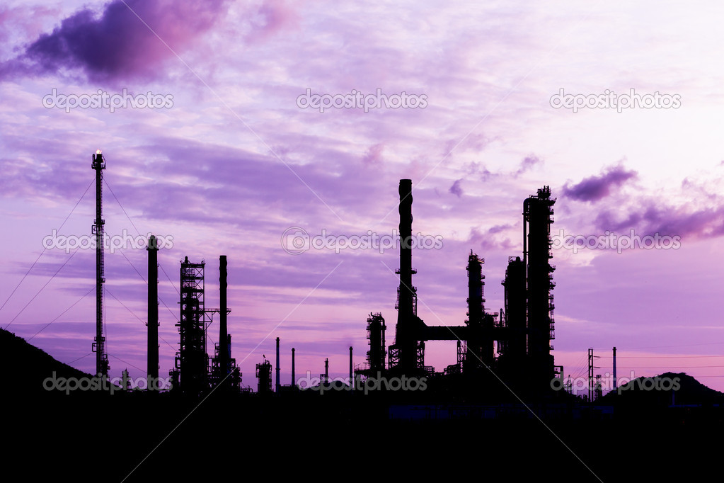 silhouette of oil refinery plant at twilight morning
