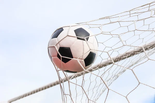 Football in the goal net — Stock Photo, Image