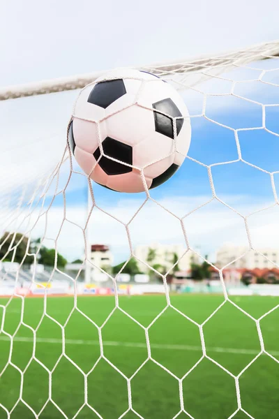 Soccer ball in goal net — Stock Photo, Image