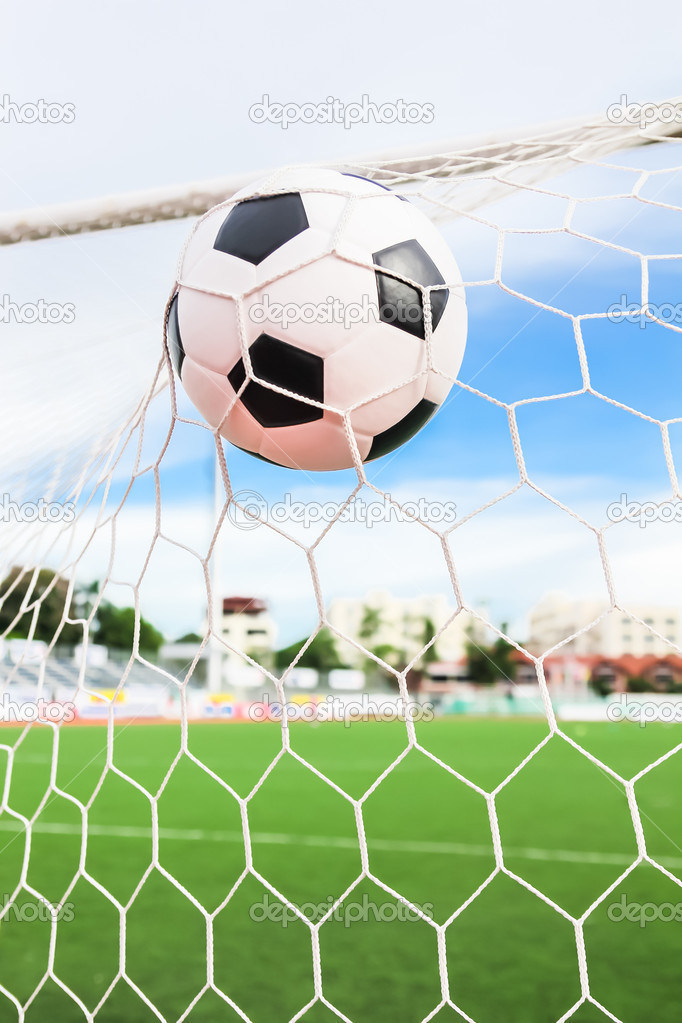 soccer ball in goal net