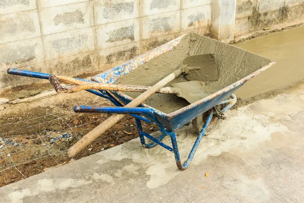 Grunge cement used tool on road — Stock Photo, Image