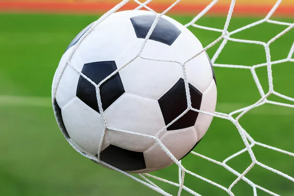 Football in goal net — Stock Photo, Image