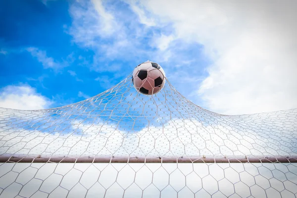 Football in goal net — Stock Photo, Image