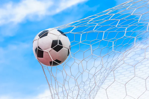 Soccer ball in goal net — Stock Photo, Image